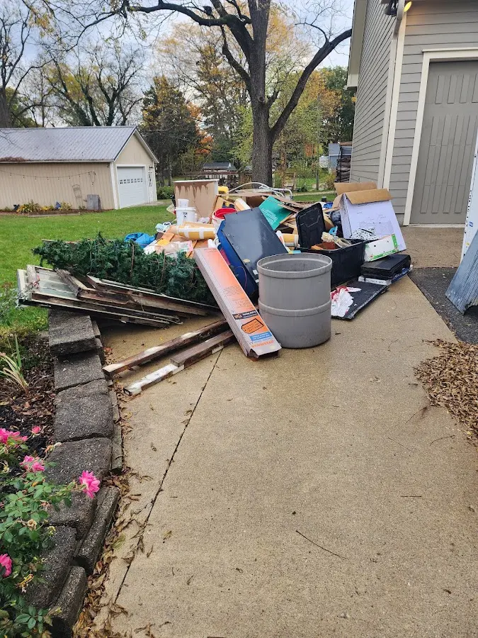 Dumpster being loaded with debris for 3 Yard Dumpster Rental in Green River